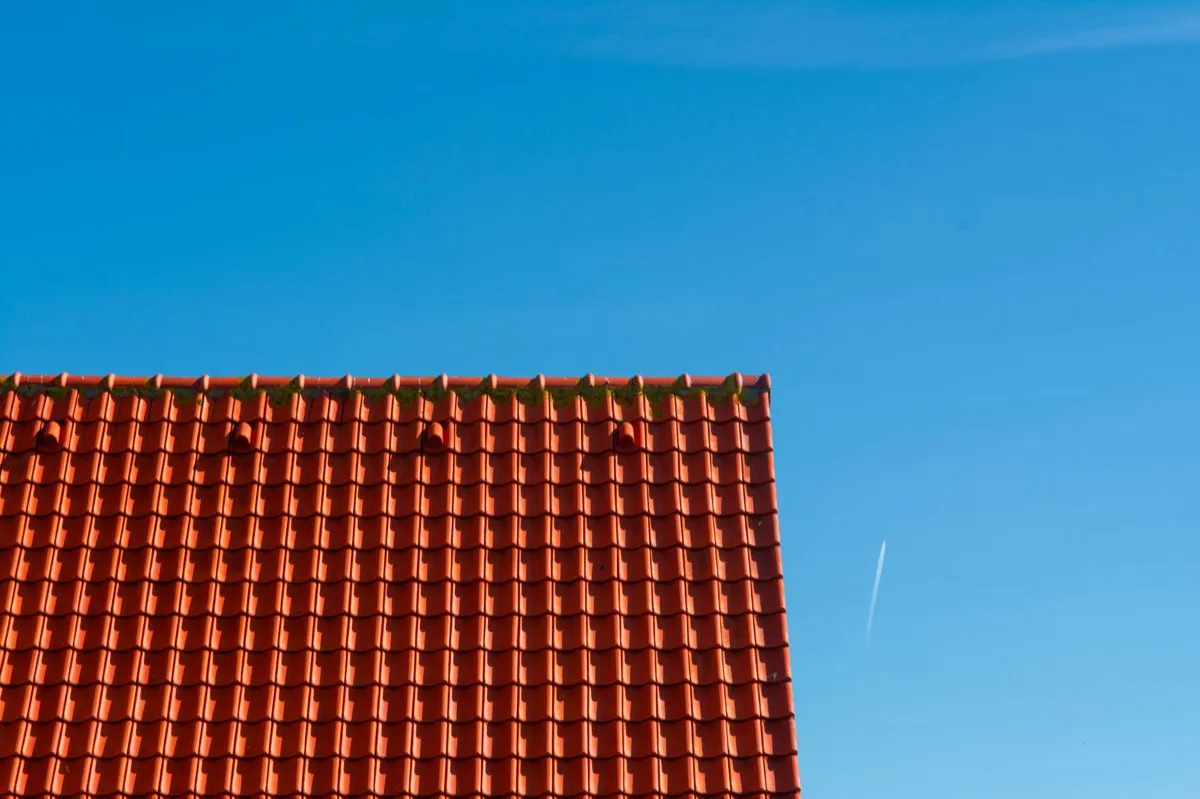 Tile roof gable in full sun, the kind of exposure that sets roof life in Novi, MI